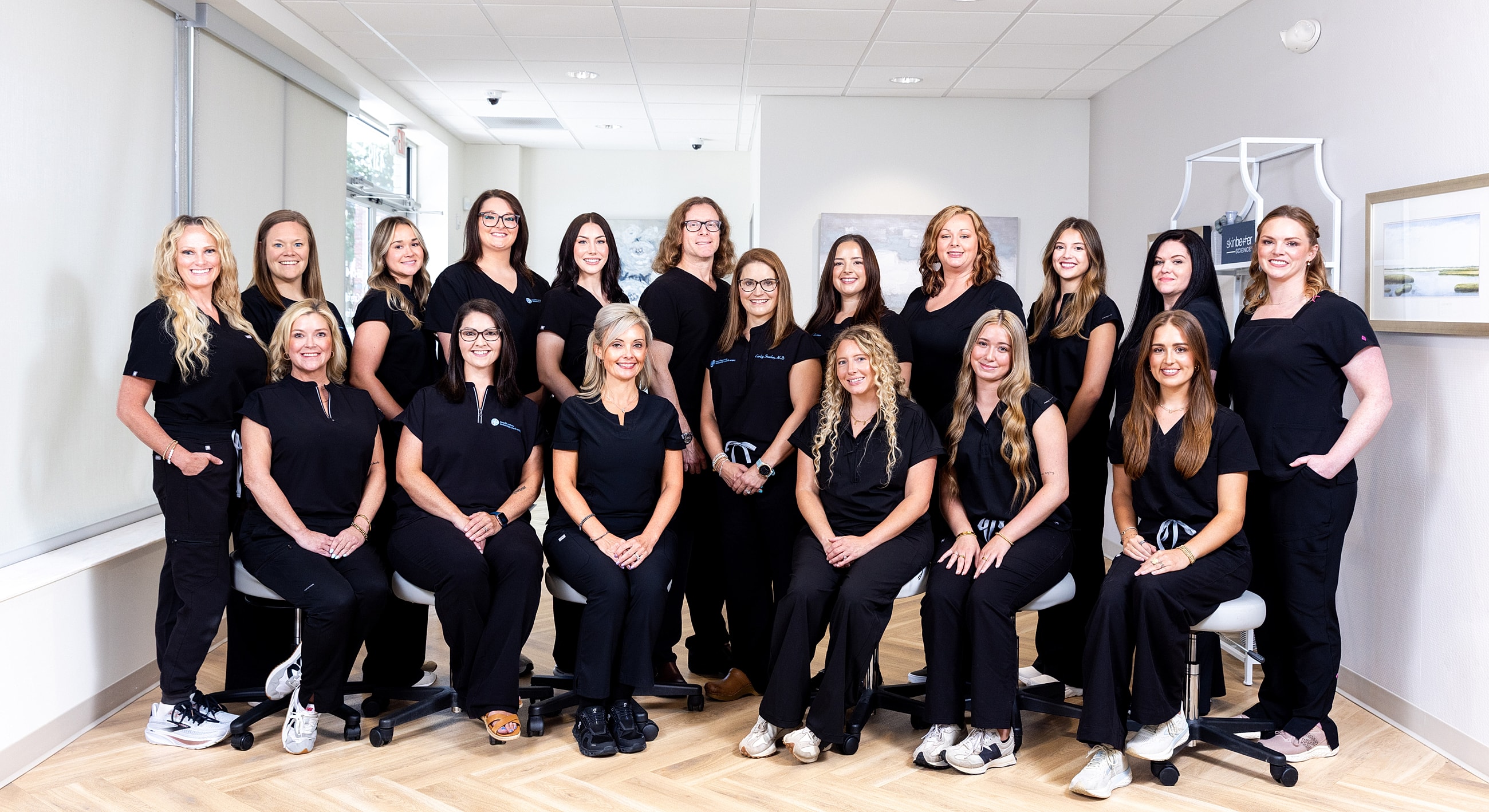 Group photo of healthcare professionals in scrubs.